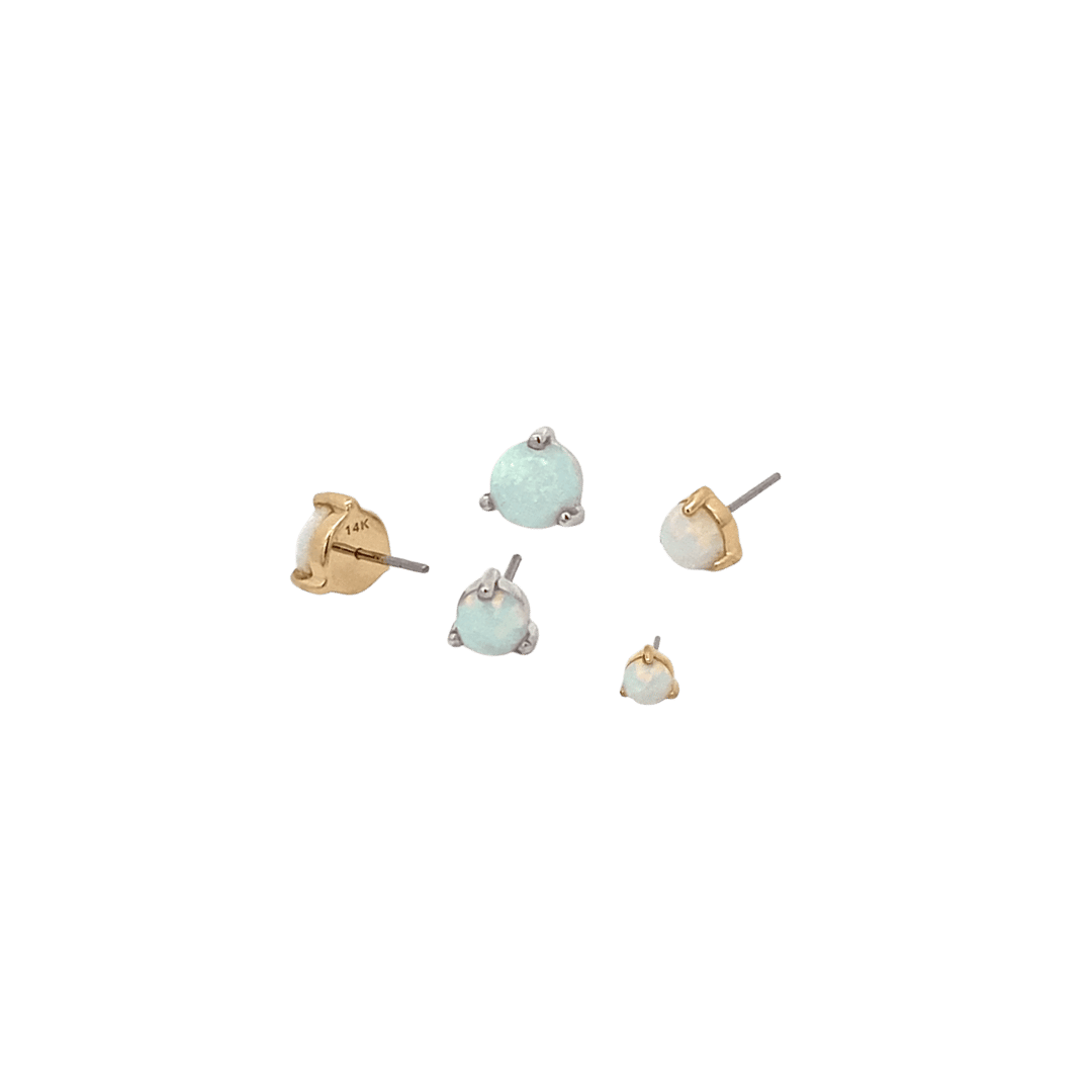 Set of small earrings on a black background