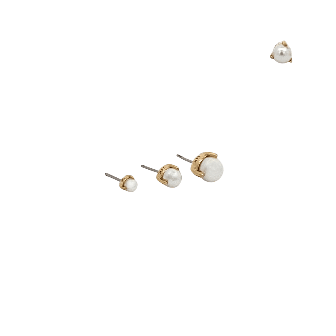 Set of pearl earrings with gold posts on a black background