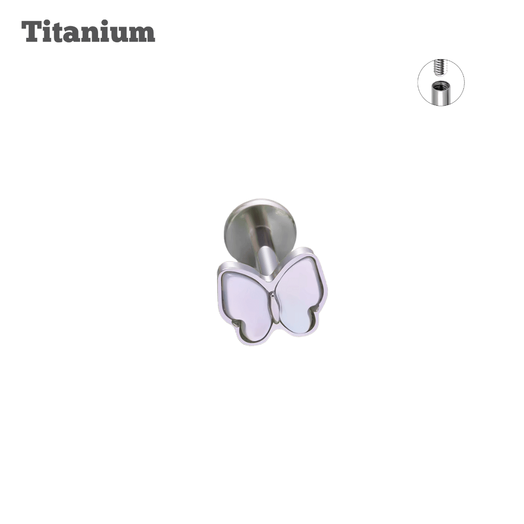 White Butterfly-shaped titanium earring on a black background