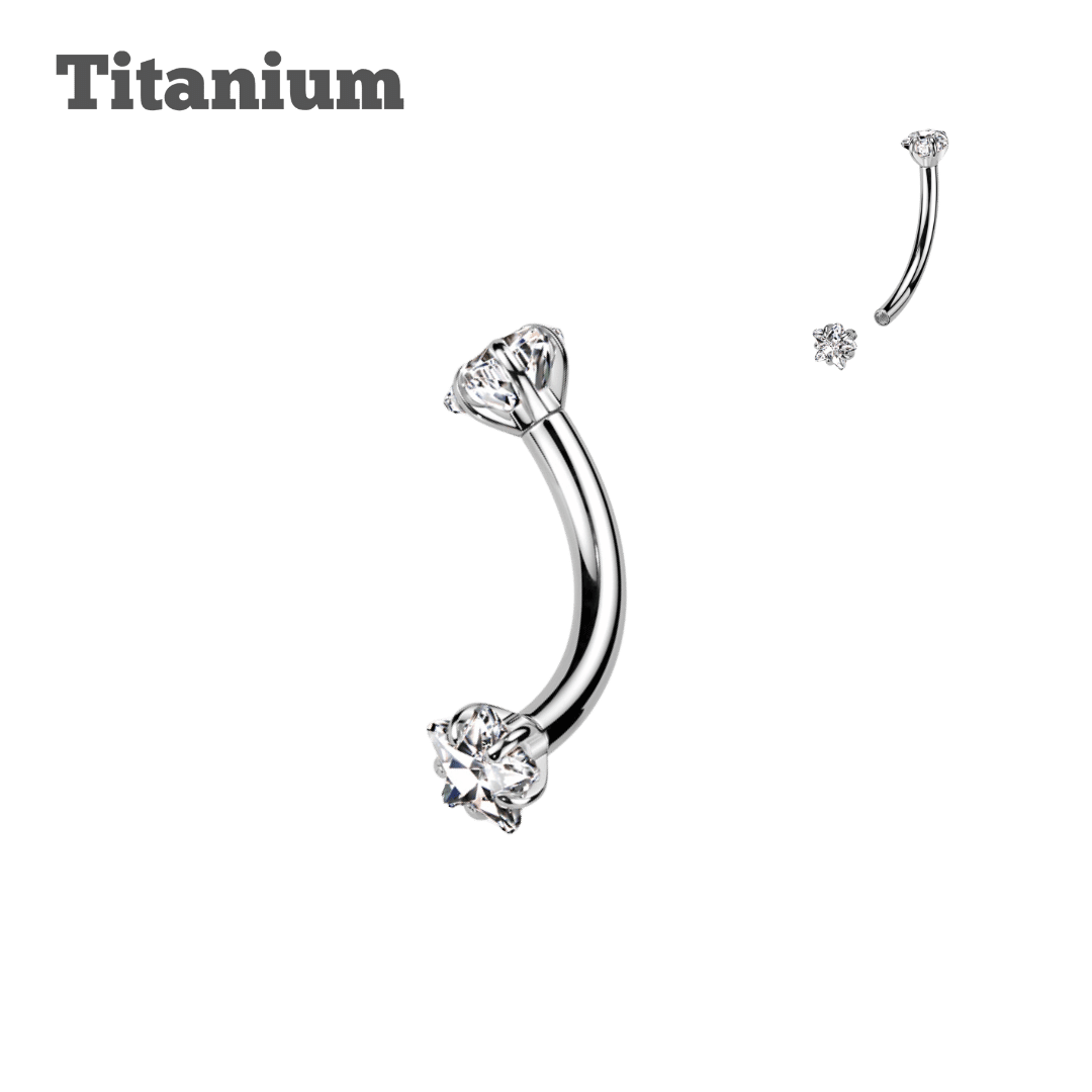 A collection of curved barbell earrings with titanium star ends in silver color