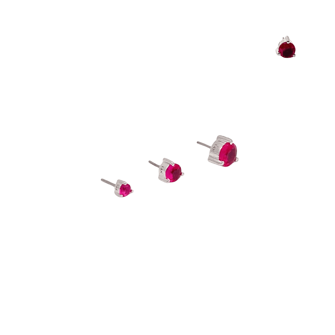 Red gemstone earrings on a black background