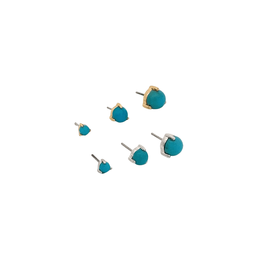 Set of turquoise stud earrings on a black background