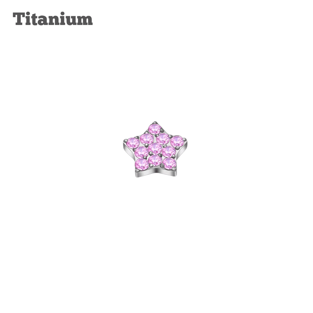 Star-shaped earring with pink stones on a black background